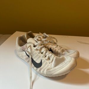 White Nike track spikes